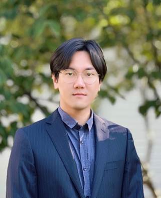 A person in a suitDescription automatically generated A person in a suitDescription automatically generated